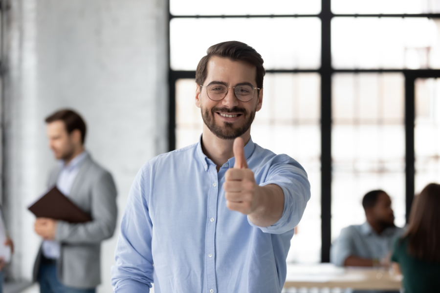 Image of a happy customer showing a thumbs up