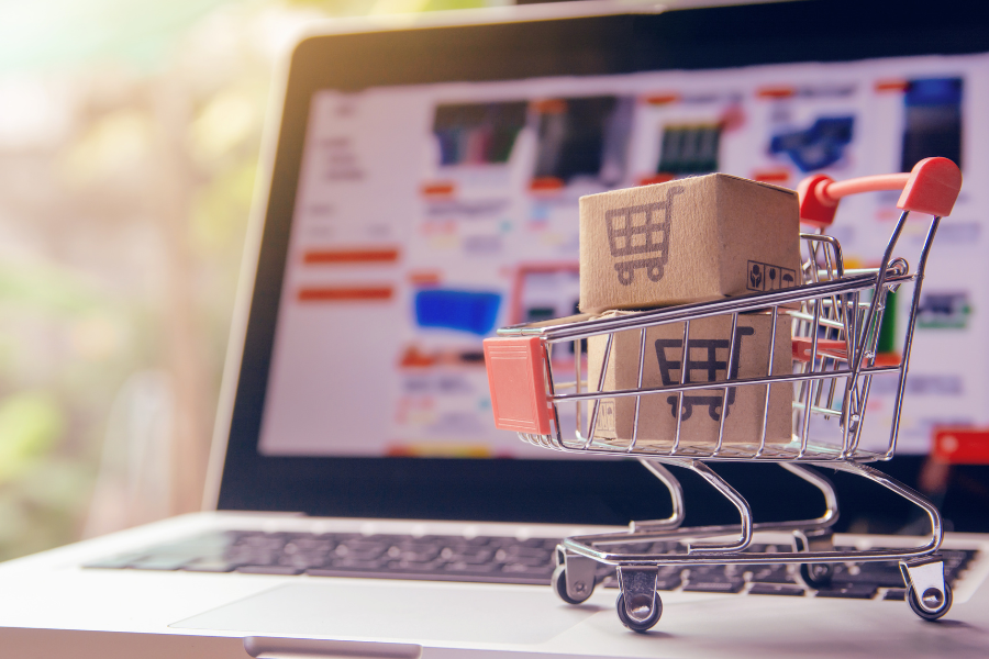 image of an ecommerce store with a shopping trolly containg boxes